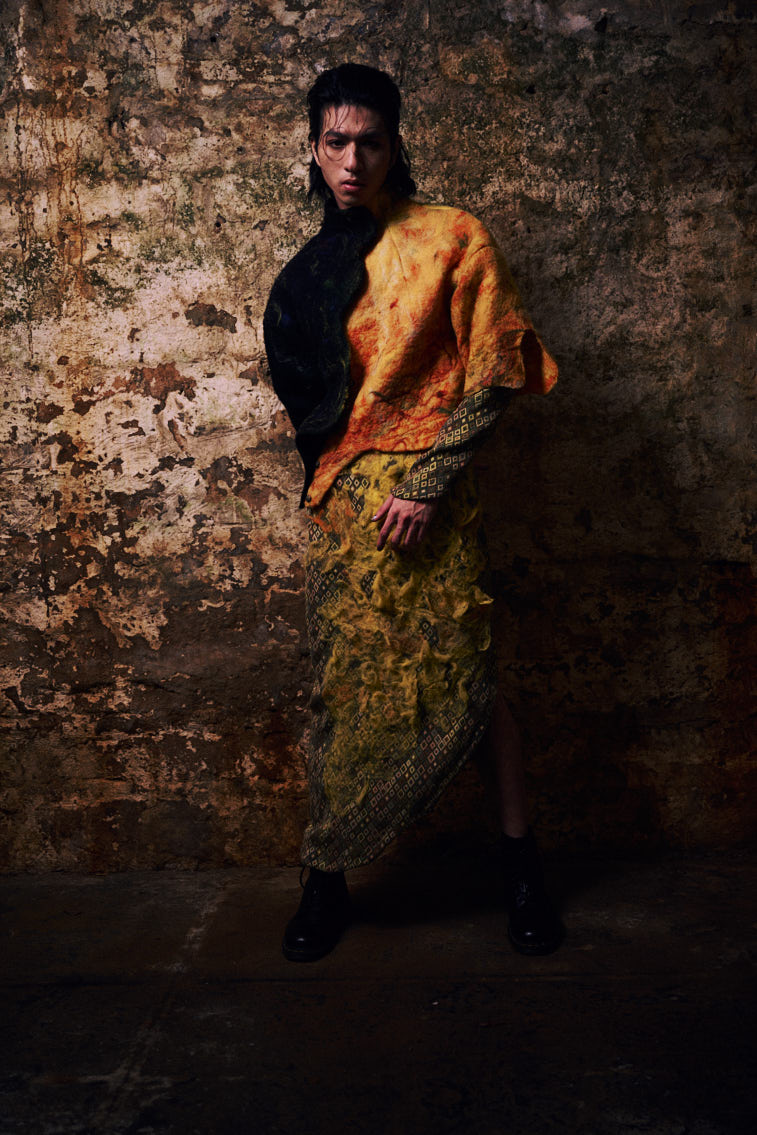 a man in wool felting cloth, warn color