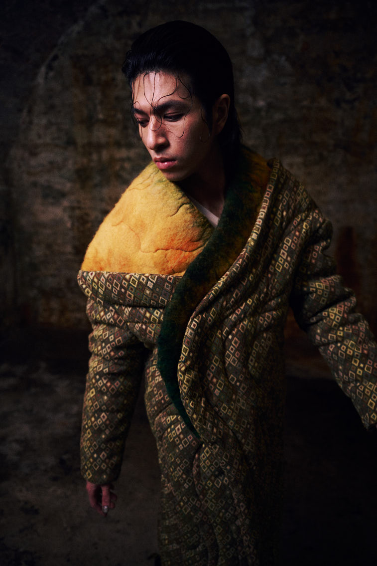 a man in wool felting cloth, warn color, in historic place, in tunnel