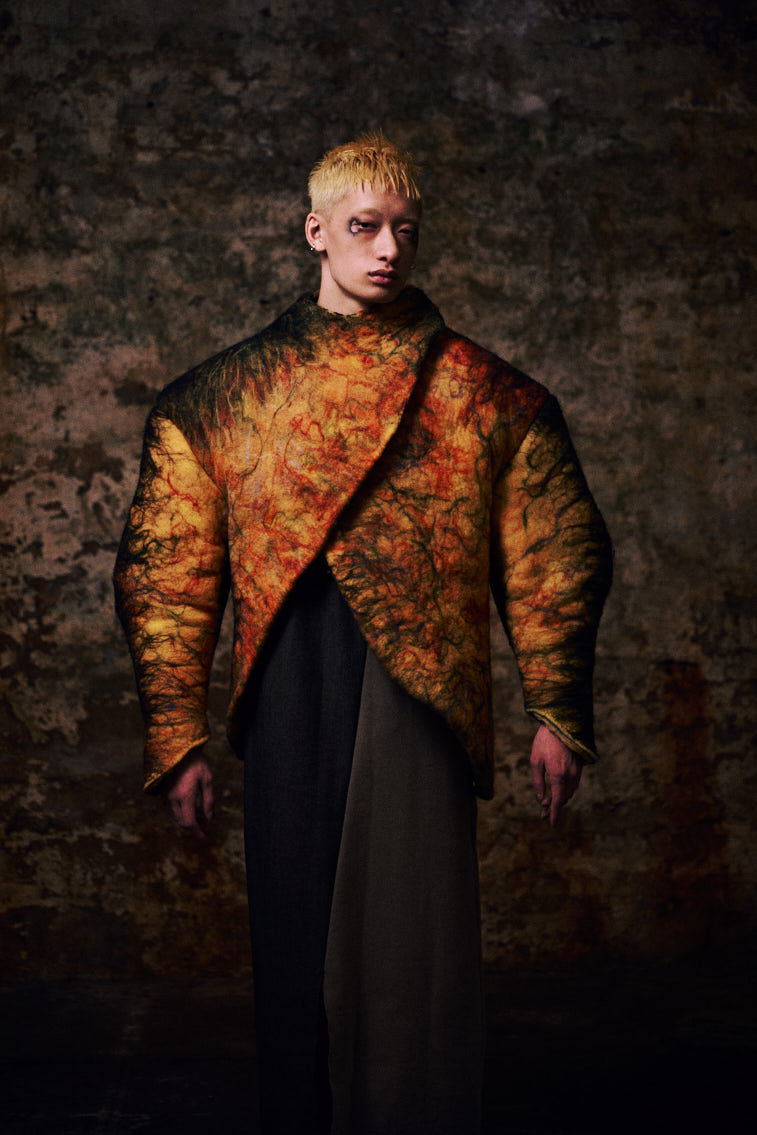 a man in wool felting cloth, warn color
