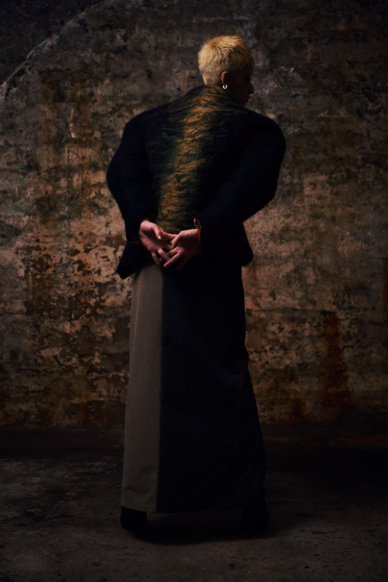 a man in wool felting cloth, warn color