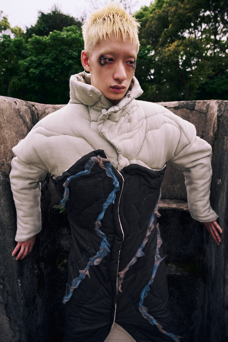 a man wear a blue tone color wool felting cloth in historic place
