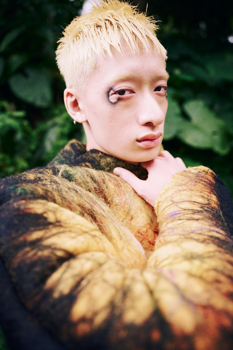 a man in wool felting cloth, warn color