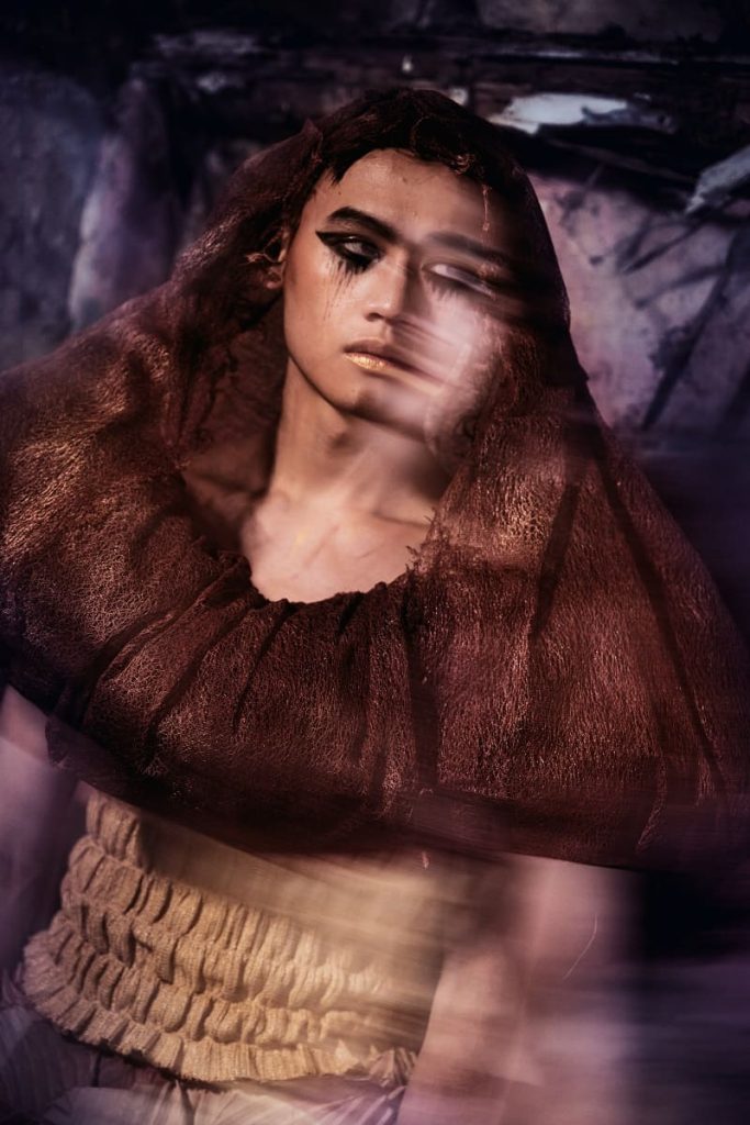 fiber art, wearable installation, man in a ruin