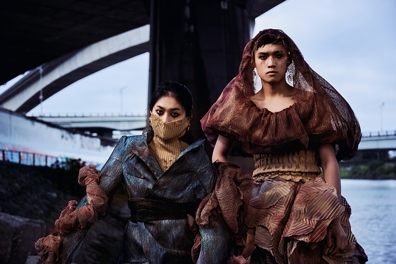 fiber art, wearable installation, two persons at the river and bank