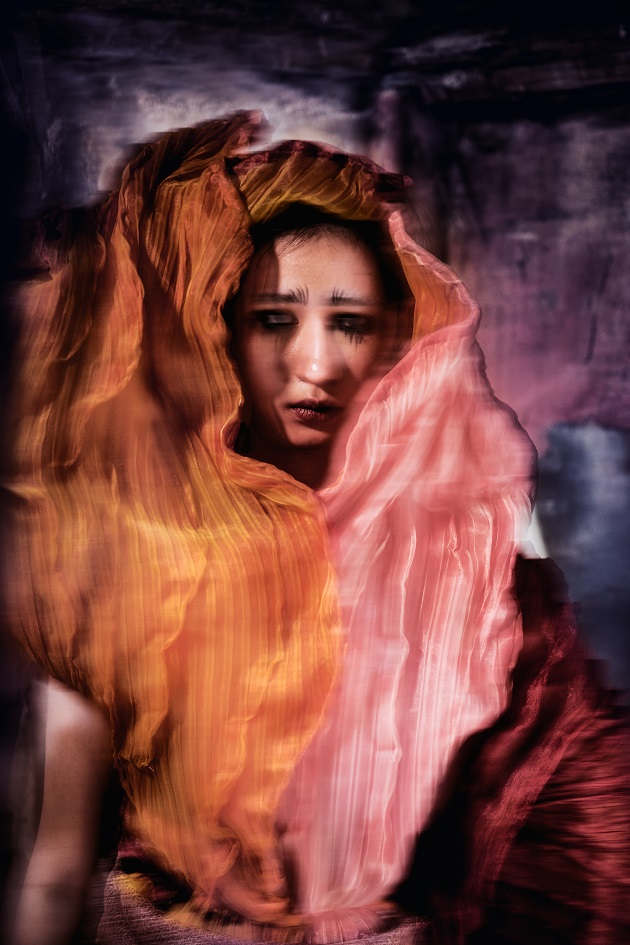 fiber art, wearable installation, sad woman in a ruin