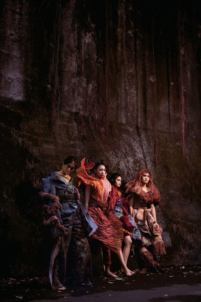 fiber art, wearable installation, four persons in a ruin