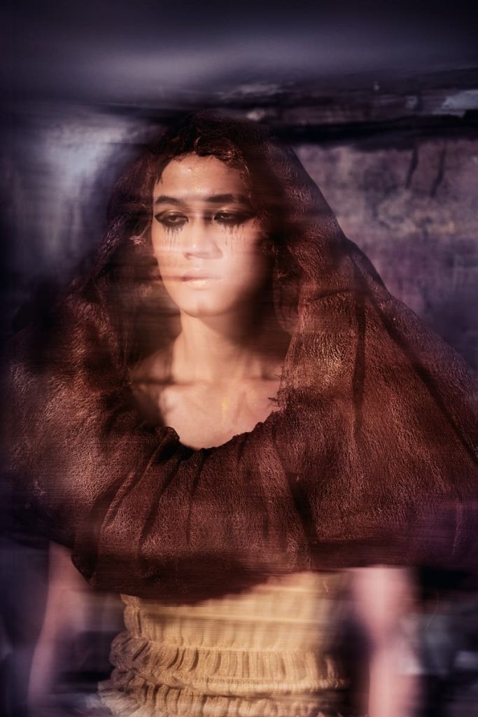 fiber art, wearable installation, man in a ruin