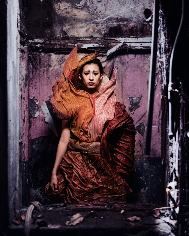 fiber art, wearable installation, sad woman in a ruin